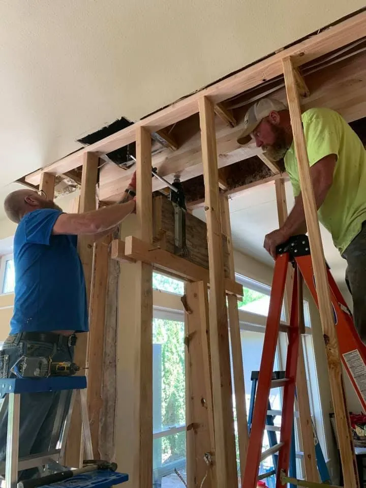 the team hard at work, about true-blue construction