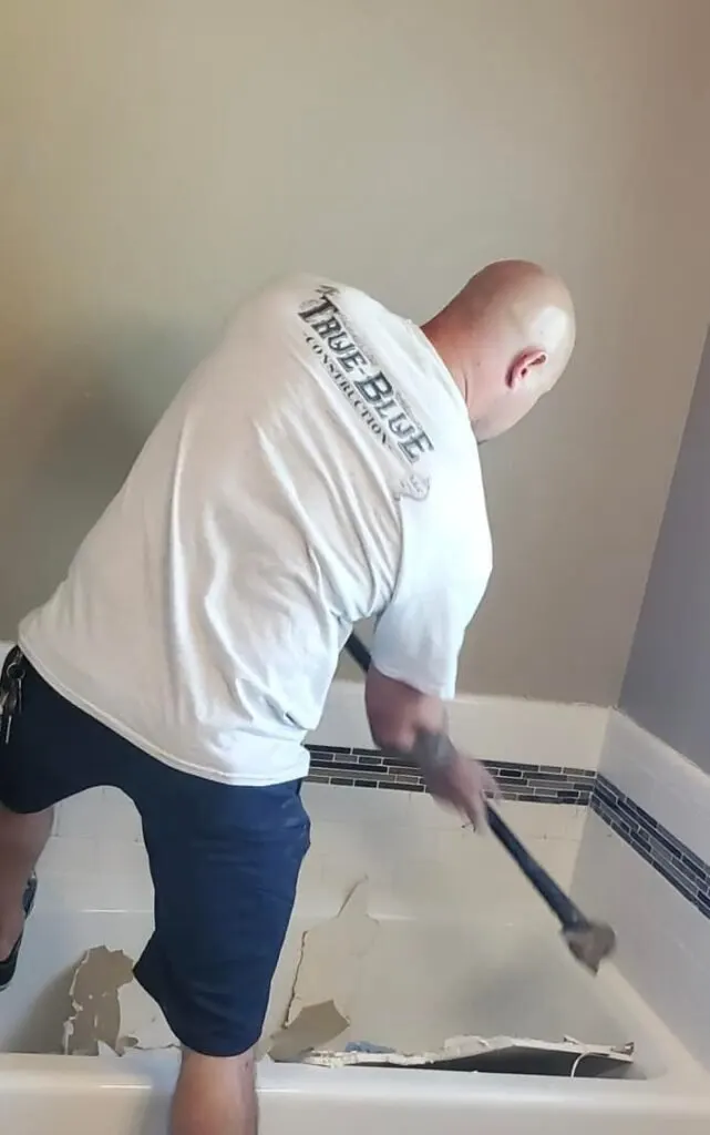 Rob demoing an old tub and surround